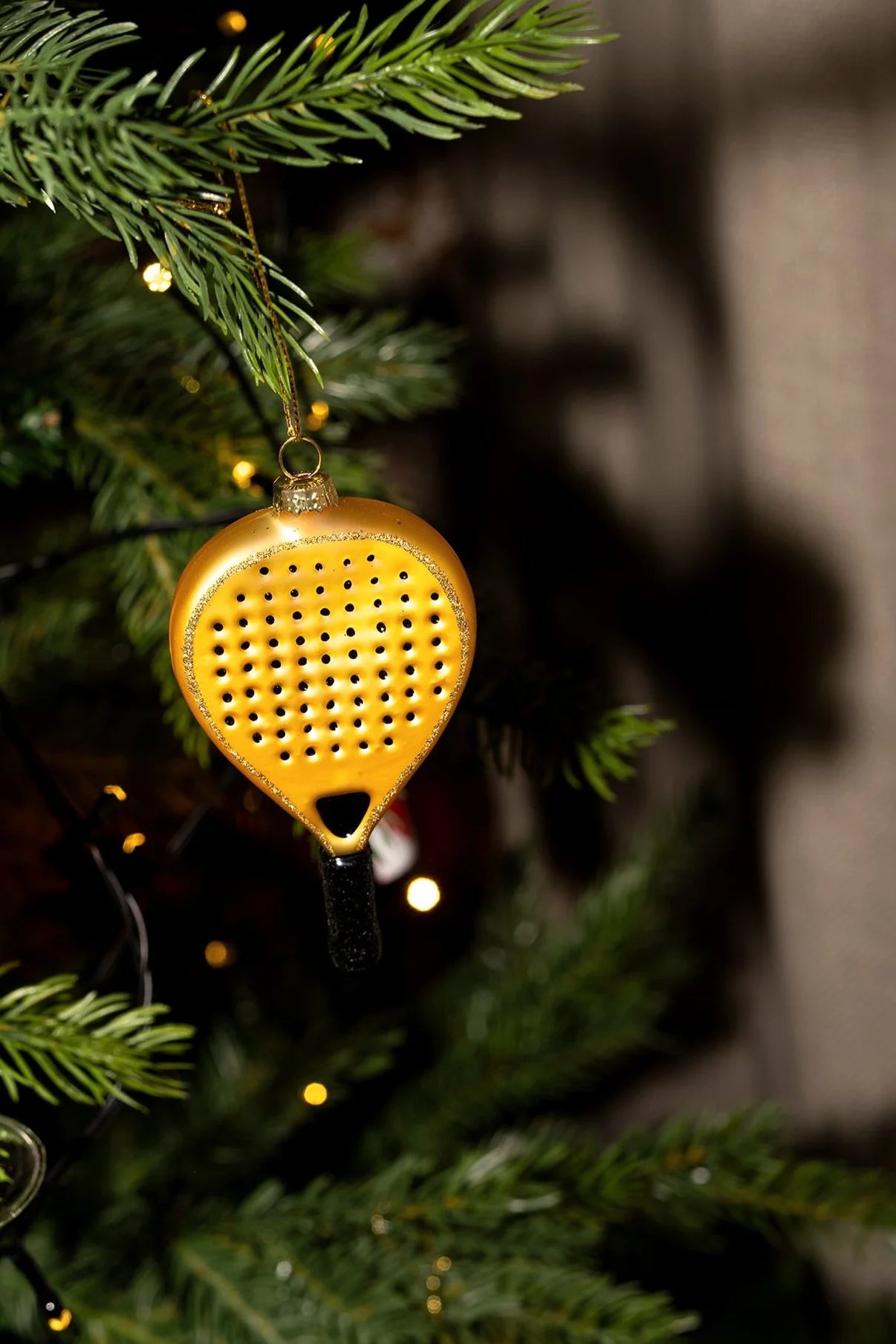 Padelracket Goud - yup in de boom