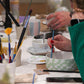 Creative workshops at Fiore Utrecht, including pottery painting and flower arranging